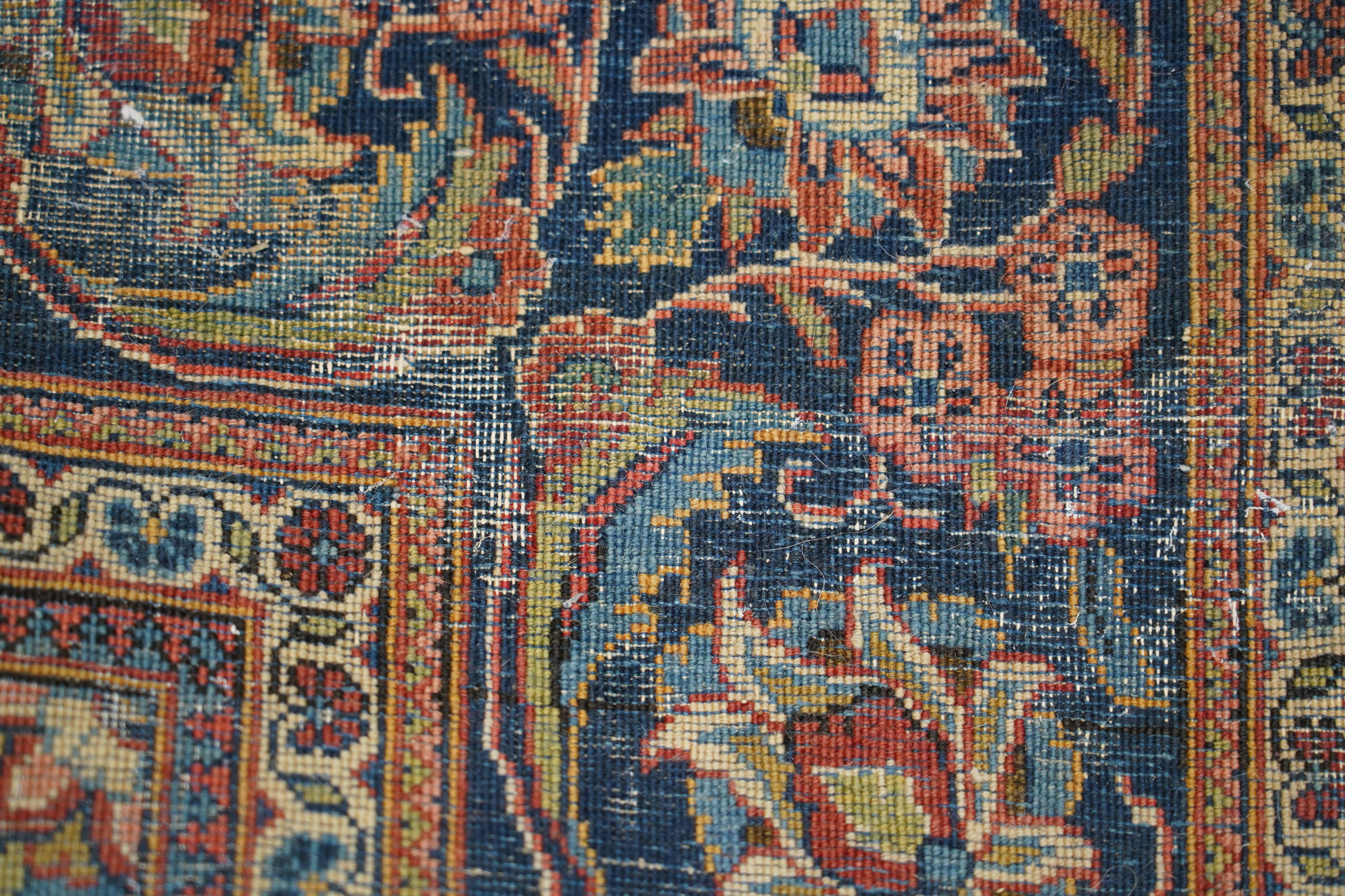 A pair of antique Tabriz brick red ground rugs, 200 x 136cm. Condition - fair